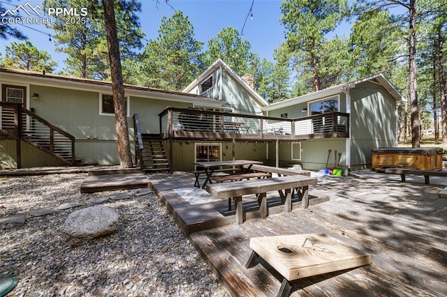 6940 Franciville Rd, Colorado Springs, CO 80908 - rear view of house with stairway, a hot tub, a deck, and a patio area