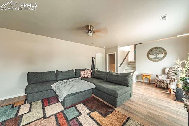 780 Foxwood Dr, Colorado Springs, CO 80911 - living room featuring wood finished floors, stairs, a ceiling fan, and baseboards