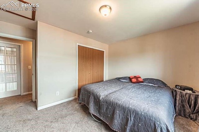 780 Foxwood Dr, Colorado Springs, CO 80911 - carpeted bedroom featuring a closet and baseboards