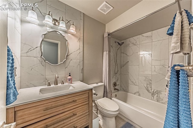 780 Foxwood Dr, Colorado Springs, CO 80911 - full bathroom featuring toilet, vanity, and shower / tub combo with curtain