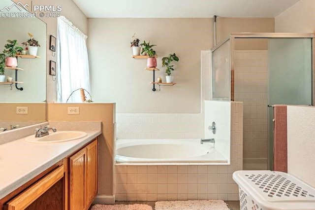 780 Foxwood Dr, Colorado Springs, CO 80911 - full bath featuring a shower stall, a garden tub, and vanity
