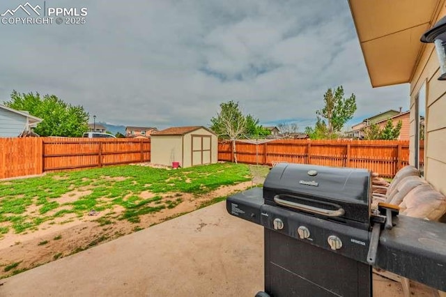 780 Foxwood Dr, Colorado Springs, CO 80911 - view of patio with a grill, a fenced backyard, a storage unit, and an outdoor structure