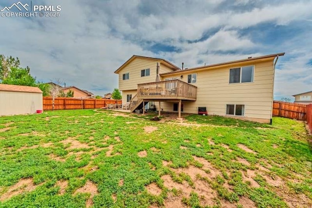 780 Foxwood Dr, Colorado Springs, CO 80911 - back of property with stairway and a wooden deck