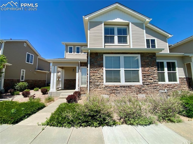 7513 Sandy Springs Pt, Fountain, CO 80817 - view of front of house featuring stone siding and a porch