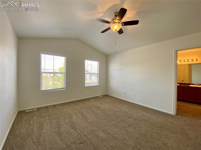 7513 Sandy Springs Pt, Fountain, CO 80817 - unfurnished room featuring carpet, a ceiling fan, vaulted ceiling, and baseboards
