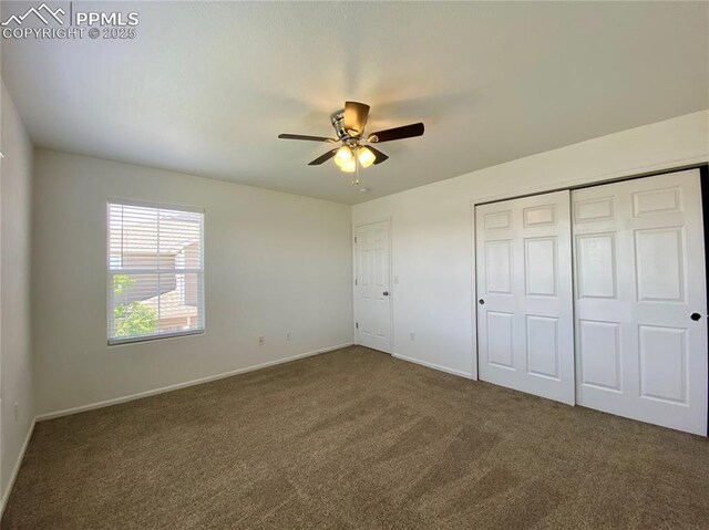 7513 Sandy Springs Pt, Fountain, CO 80817 - unfurnished bedroom featuring carpet, baseboards, a closet, and ceiling fan