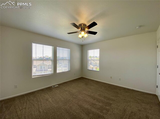 7513 Sandy Springs Pt, Fountain, CO 80817 - unfurnished room with dark carpet, baseboards, and ceiling fan