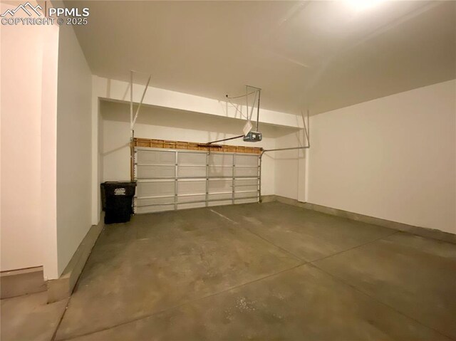 7513 Sandy Springs Pt, Fountain, CO 80817 - garage with a garage door opener and baseboards