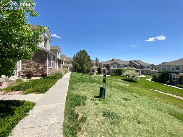 7513 Sandy Springs Pt, Fountain, CO 80817 - view of community featuring a residential view and a lawn