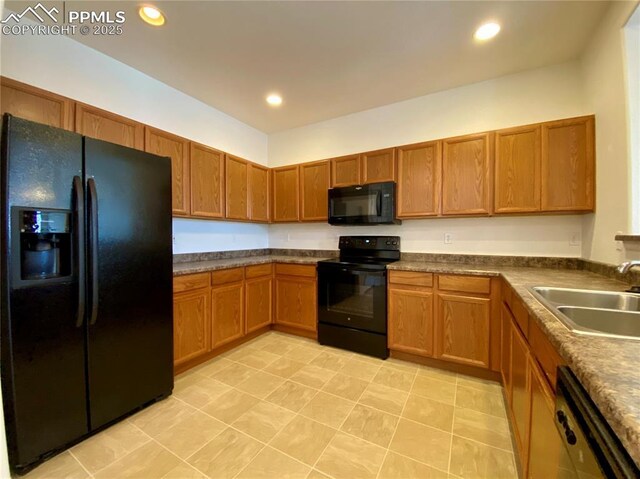 7513 Sandy Springs Pt, Fountain, CO 80817 - kitchen featuring black appliances, a sink, brown cabinets, recessed lighting, and dark countertops