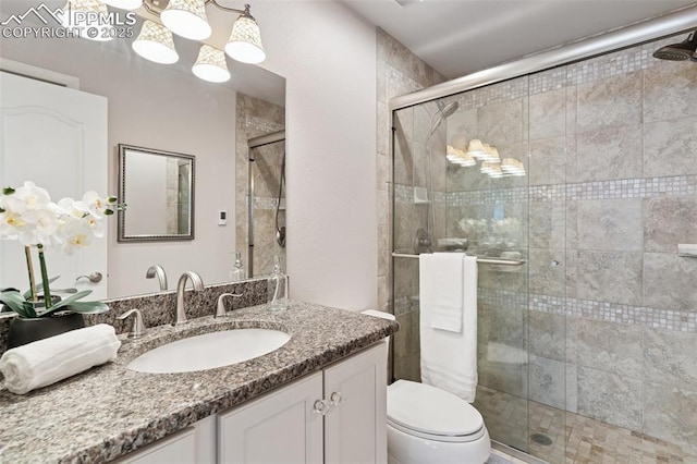 603 Three Eagles St, Colorado Springs, CO 80905 - full bathroom featuring vanity, toilet, and a stall shower