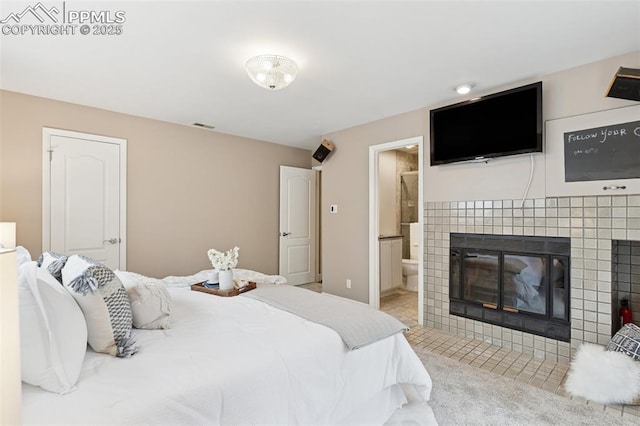 603 Three Eagles St, Colorado Springs, CO 80905 - tiled bedroom with a fireplace and ensuite bath