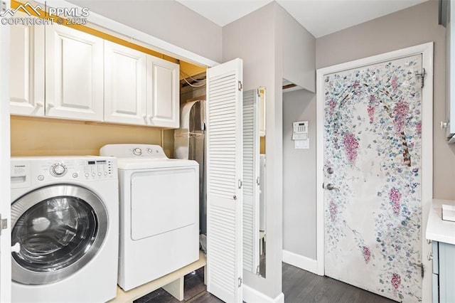603 Three Eagles St, Colorado Springs, CO 80905 - washroom featuring washing machine and dryer, cabinet space, dark wood-style flooring, and baseboards