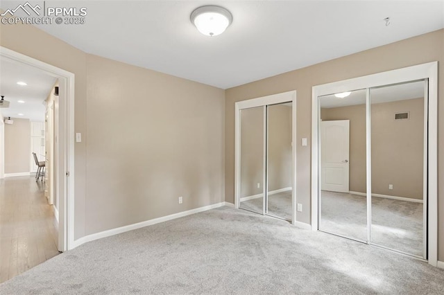 603 Three Eagles St, Colorado Springs, CO 80905 - unfurnished bedroom featuring multiple closets, baseboards, carpet floors, and recessed lighting