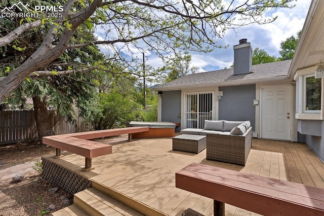 603 Three Eagles St, Colorado Springs, CO 80905 - wooden deck featuring a hot tub and an outdoor living space