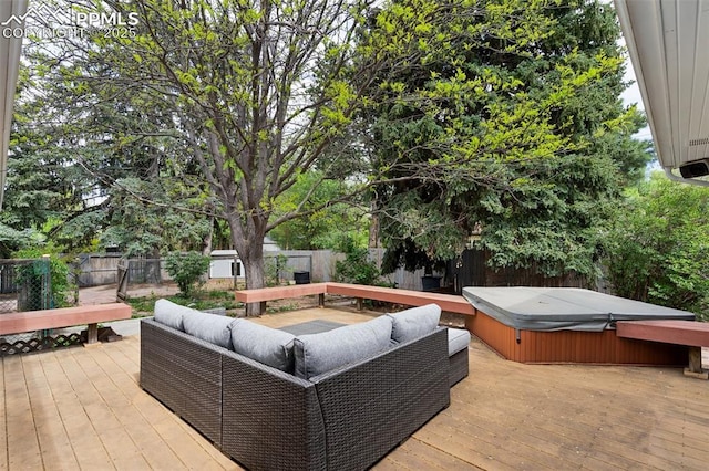 603 Three Eagles St, Colorado Springs, CO 80905 - wooden deck with a hot tub, a fenced backyard, and an outdoor living space
