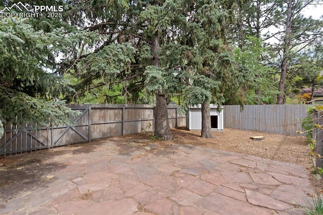 603 Three Eagles St, Colorado Springs, CO 80905 - fenced backyard featuring a patio and a gate