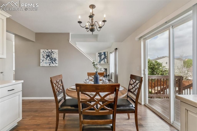 8463 Shadow Run Ln, Fountain, CO 80817 - dining space featuring light wood-type flooring, a chandelier, and baseboards