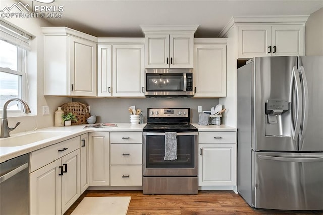 8463 Shadow Run Ln, Fountain, CO 80817 - kitchen featuring stainless steel appliances, a sink, and light countertops