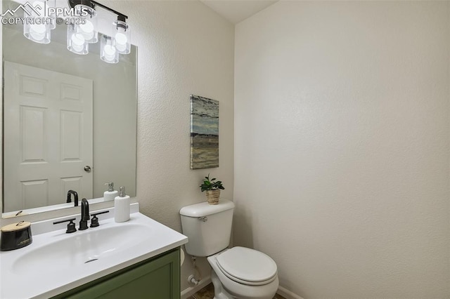 8463 Shadow Run Ln, Fountain, CO 80817 - half bath with toilet, vanity, and baseboards