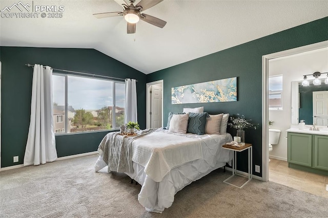 8463 Shadow Run Ln, Fountain, CO 80817 - bedroom featuring lofted ceiling, light colored carpet, a sink, ensuite bath, and ceiling fan
