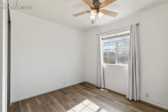 8463 Shadow Run Ln, Fountain, CO 80817 - unfurnished room with wood finished floors, ceiling fan, and baseboards