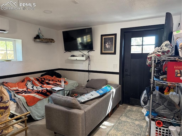 1005 S Cascade Ave, Colorado Springs, CO 80903 - living area featuring healthy amount of natural light, wainscoting, and a wall mounted AC