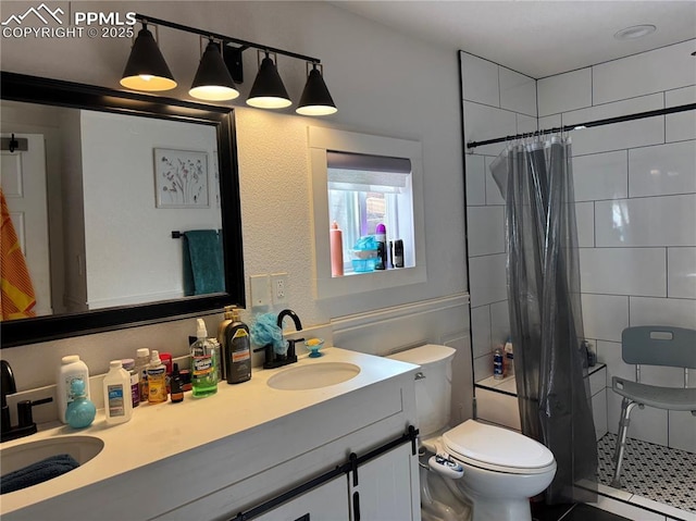 1005 S Cascade Ave, Colorado Springs, CO 80903 - full bathroom with a baseboard heating unit, a shower stall, toilet, and double vanity