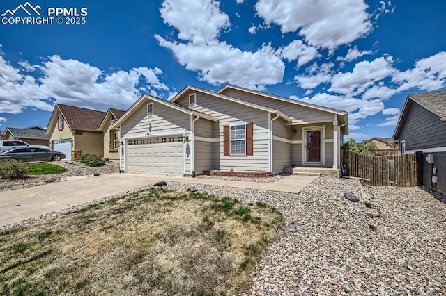 6563 Alibi Cir, Colorado Springs, CO 80923 - ranch-style home with fence, an attached garage, and concrete driveway