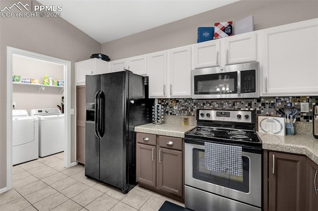 629 Golden Eagle Dr, Colorado Springs, CO 80916 - kitchen featuring appliances with stainless steel finishes, separate washer and dryer, light tile patterned flooring, and tasteful backsplash