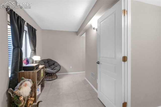 629 Golden Eagle Dr, Colorado Springs, CO 80916 - living area featuring baseboards and light tile patterned floors