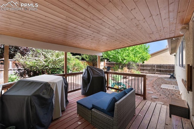 629 Golden Eagle Dr, Colorado Springs, CO 80916 - wooden deck featuring area for grilling and a fenced backyard