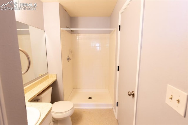 7630 Pebble Path Pl, Colorado Springs, CO 80920 - bathroom featuring toilet, a tile shower, and vanity