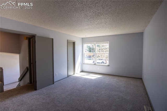 7630 Pebble Path Pl, Colorado Springs, CO 80920 - unfurnished bedroom featuring carpet and a textured ceiling