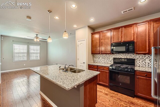 8883 White Prairie Vw, Colorado Springs, CO 80924 - kitchen with black appliances, a sink, ceiling fan, tasteful backsplash, and recessed lighting