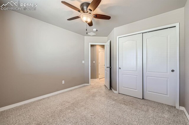 8883 White Prairie Vw, Colorado Springs, CO 80924 - unfurnished bedroom with light carpet, baseboards, a closet, and ceiling fan