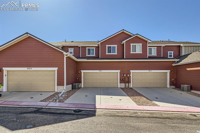 8883 White Prairie Vw, Colorado Springs, CO 80924 - view of property with cooling unit, concrete driveway, and a garage