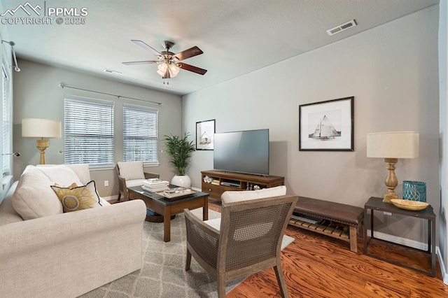 8883 White Prairie Vw, Colorado Springs, CO 80924 - living room featuring ceiling fan and baseboards