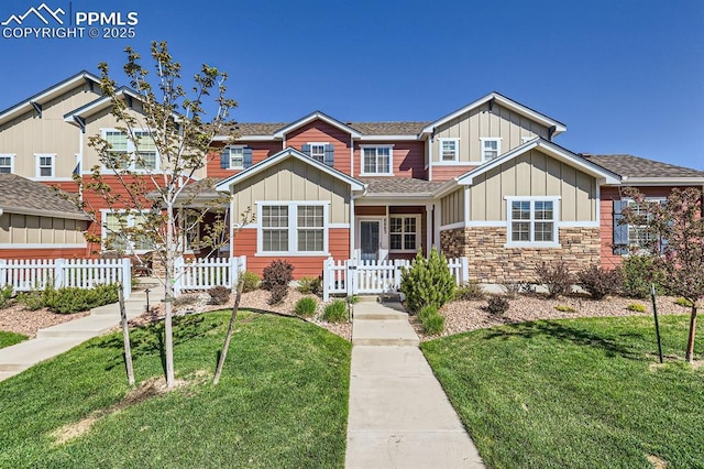 8883 White Prairie Vw, Colorado Springs, CO 80924 - view of front of house with board and batten siding, a shingled roof, and stone siding