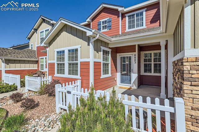 8883 White Prairie Vw, Colorado Springs, CO 80924 - view of front facade with board and batten siding and fence