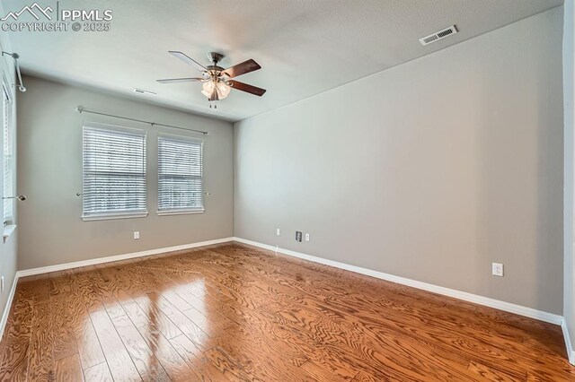 8883 White Prairie Vw, Colorado Springs, CO 80924 - spare room featuring ceiling fan, wood finished floors, and baseboards