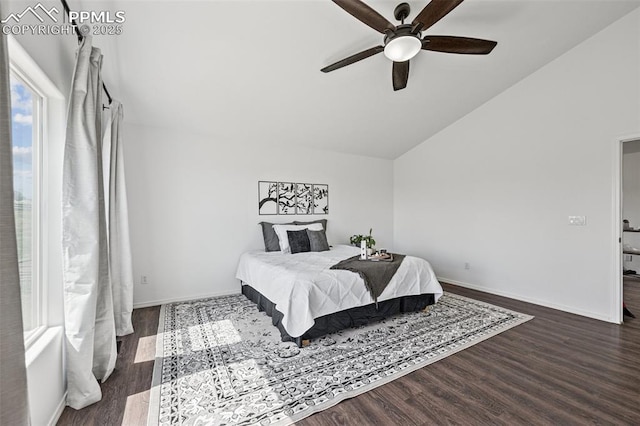 bedroom featuring vaulted ceiling, wood finished floors, baseboards, and a ceiling fan