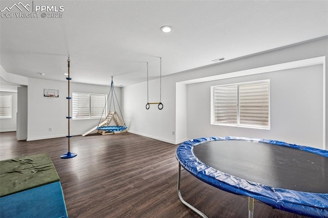 game room featuring wood finished floors, baseboards, and recessed lighting