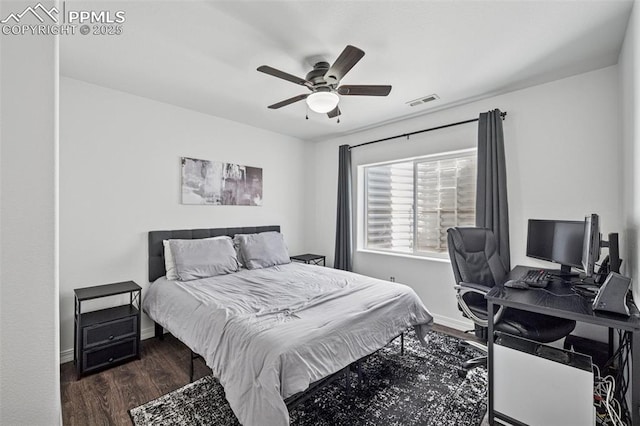 bedroom with wood finished floors, baseboards, a desk, and ceiling fan