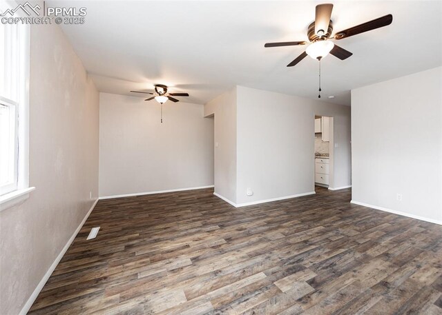 909 E Costilla St, Colorado Springs, CO 80903 - empty room with ceiling fan, dark wood-type flooring, and baseboards