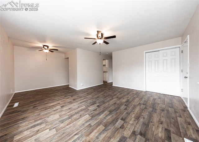 909 E Costilla St, Colorado Springs, CO 80903 - unfurnished living room featuring a ceiling fan, baseboards, and dark wood-type flooring