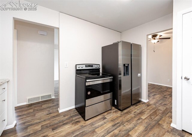 909 E Costilla St, Colorado Springs, CO 80903 - kitchen with appliances with stainless steel finishes, dark wood finished floors, a ceiling fan, and white cabinets
