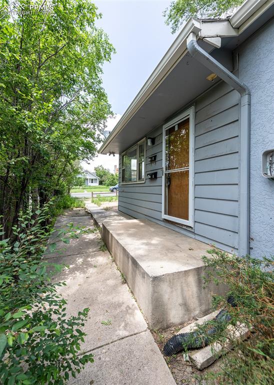 909 E Costilla St, Colorado Springs, CO 80903 - property entrance with stucco siding