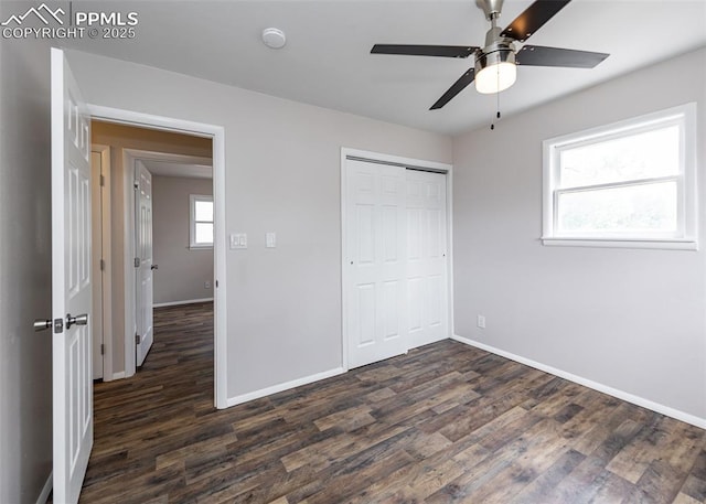 909 E Costilla St, Colorado Springs, CO 80903 - unfurnished bedroom featuring dark wood-type flooring, baseboards, and a closet