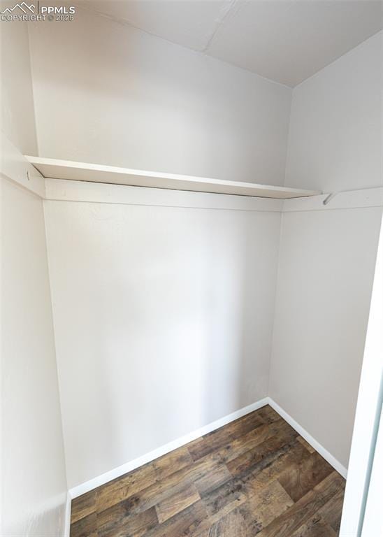 909 E Costilla St, Colorado Springs, CO 80903 - spacious closet with dark wood-style flooring